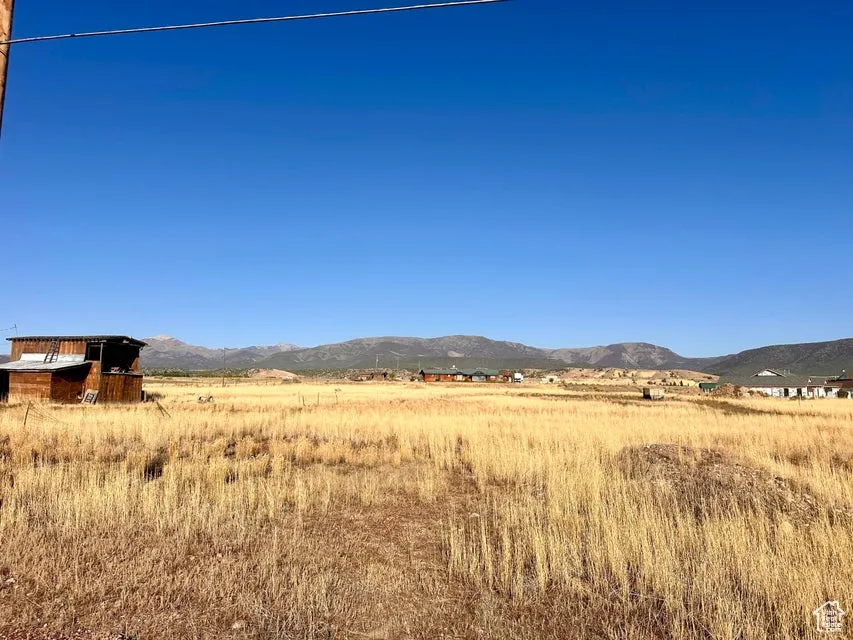 View of mountain backdrop featuring rural landscape