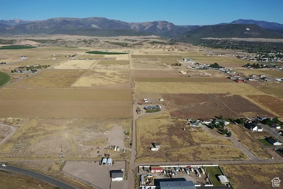 View of property location featuring a mountain backdrop and rural landscape