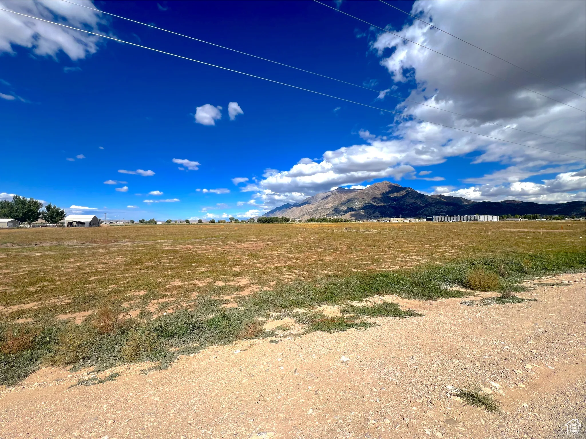View of mountain backdrop featuring rural landscape