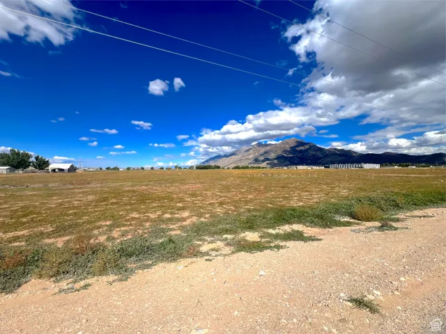 View of mountain backdrop featuring rural landscape