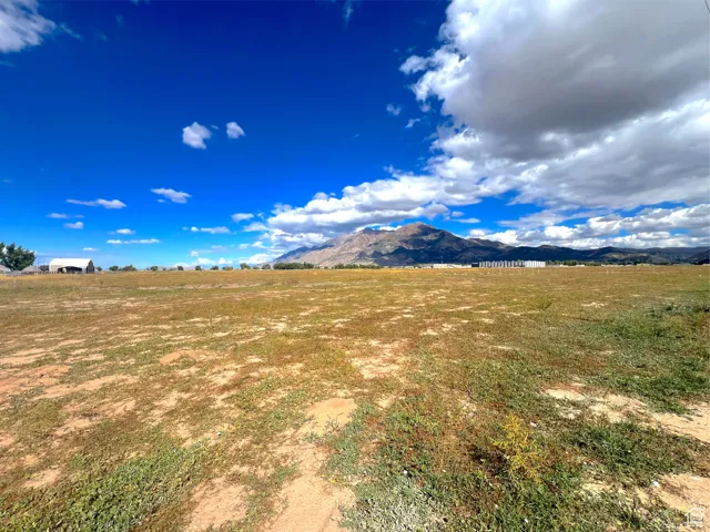 View of mountain background featuring rural landscape