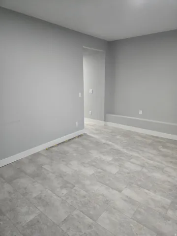 Room featuring baseboards