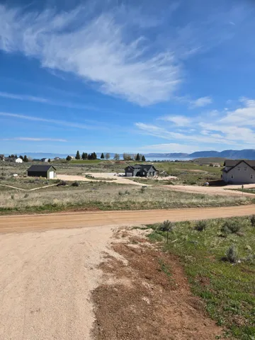 View of dirt / gravel road with a mountain view