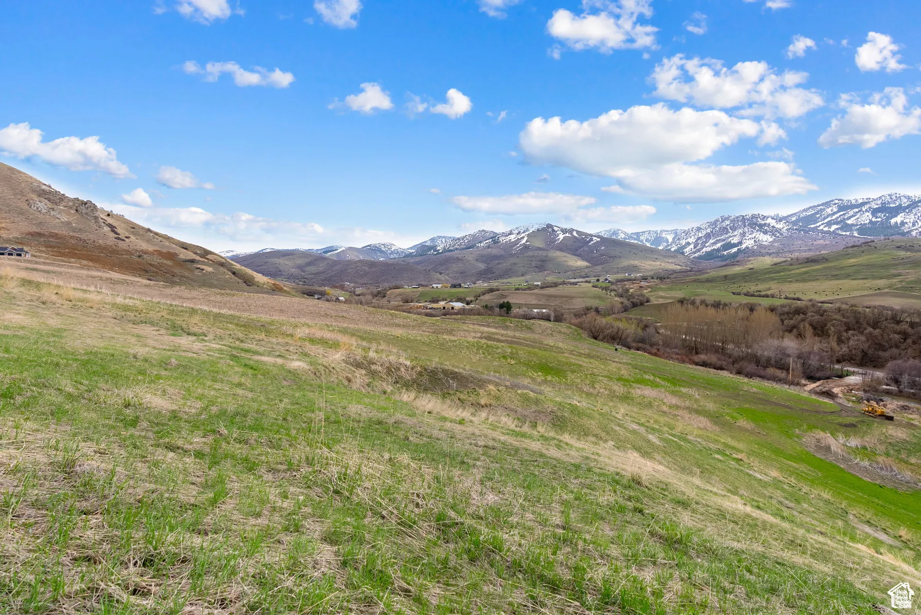 View of mountain background featuring rural landscape