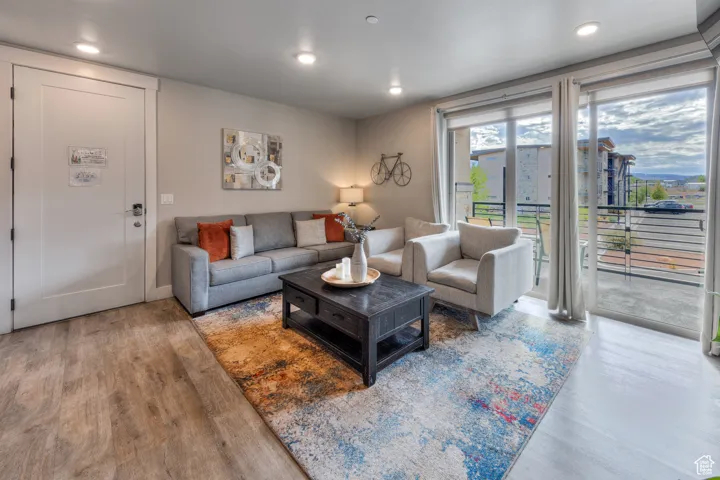 Living room with wood finished floors and recessed lighting