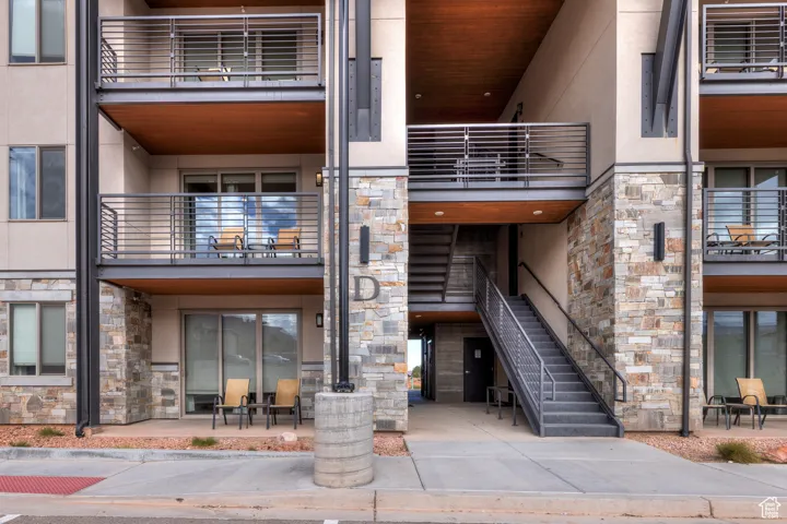 View of apartment building / complex featuring stairs