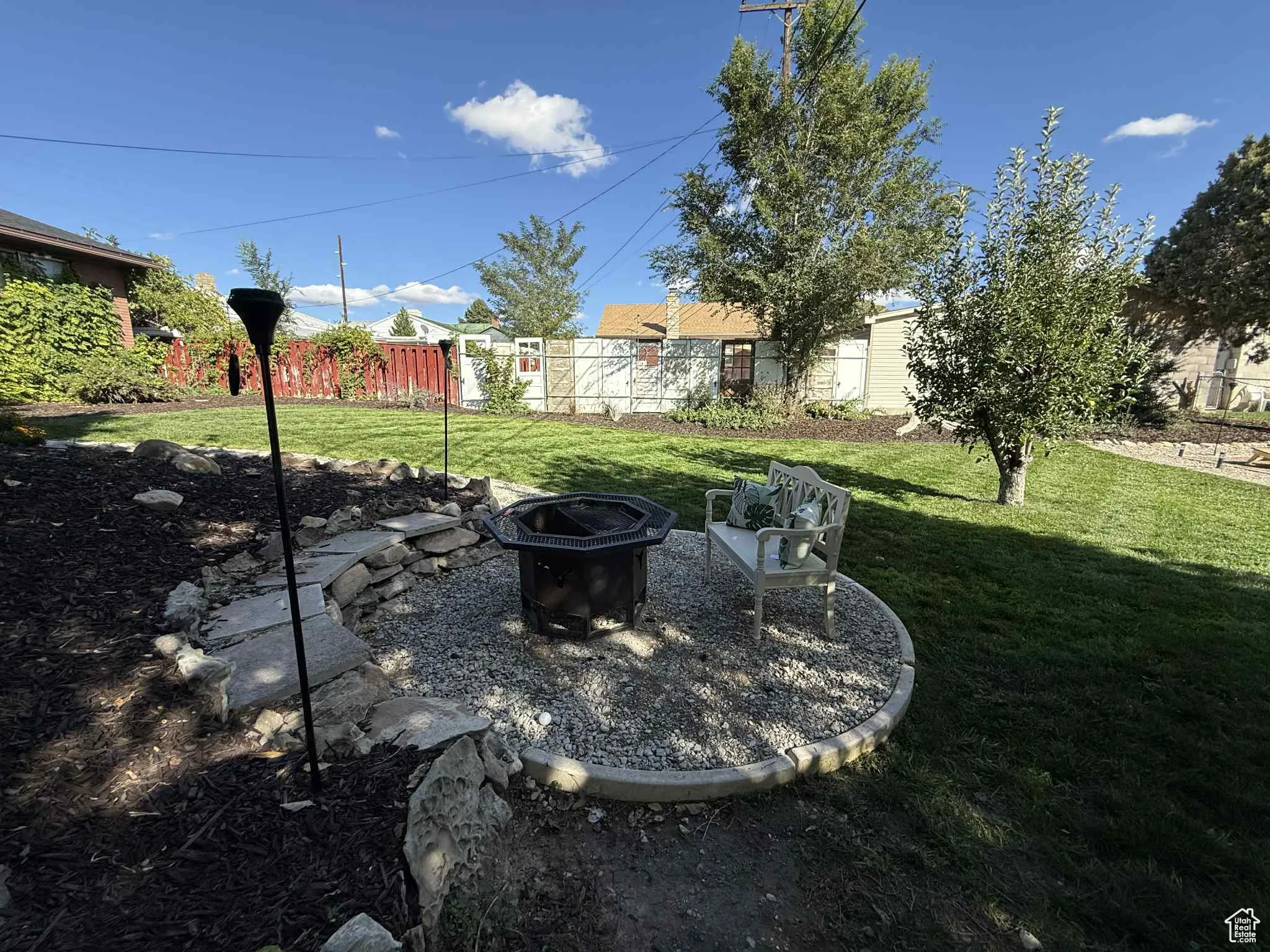 View of yard featuring an outdoor fire pit and a patio area