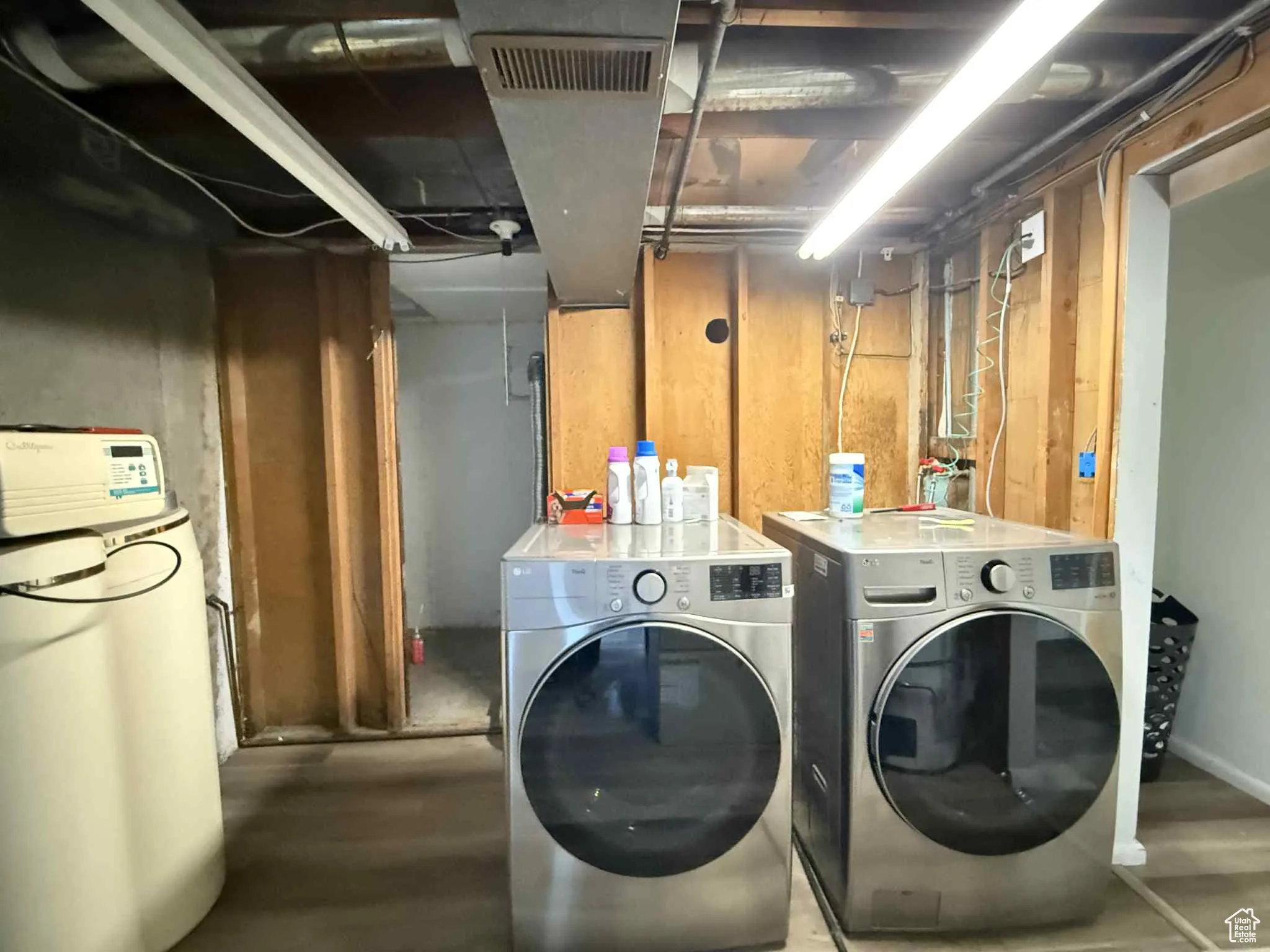 Laundry area featuring independent washer and dryer