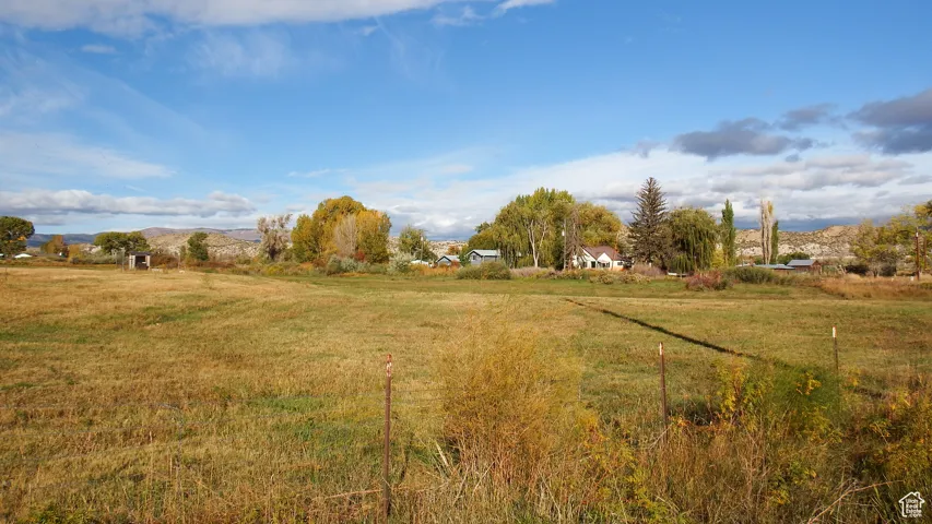 View of yard with a mountain view and a view of countryside