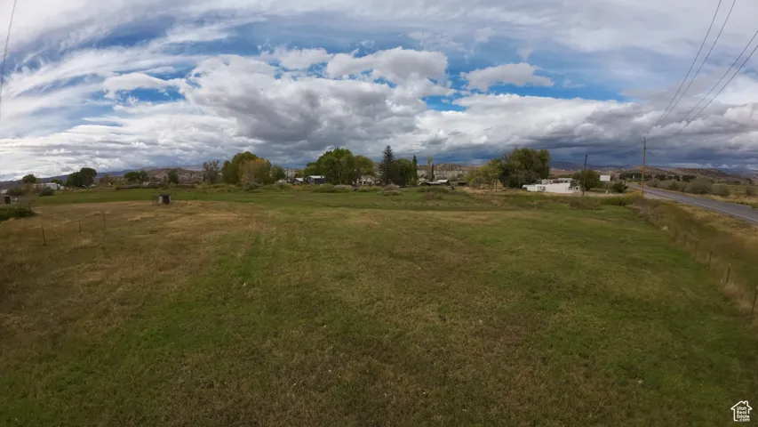 View of green lawn with a view of rural / pastoral area