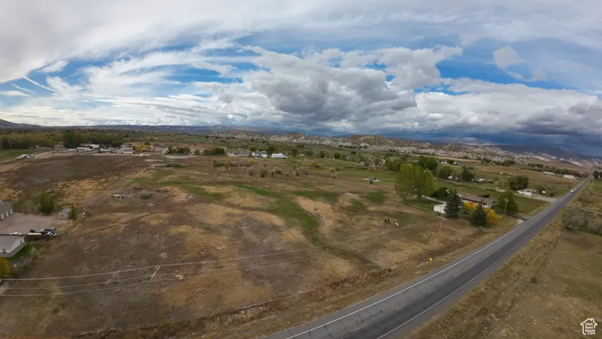 Aerial view of sparsely populated area featuring a mountain backdrop