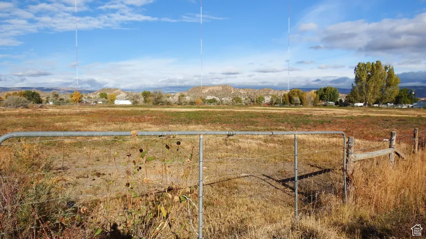 View of yard featuring a view of countryside and a mountain view