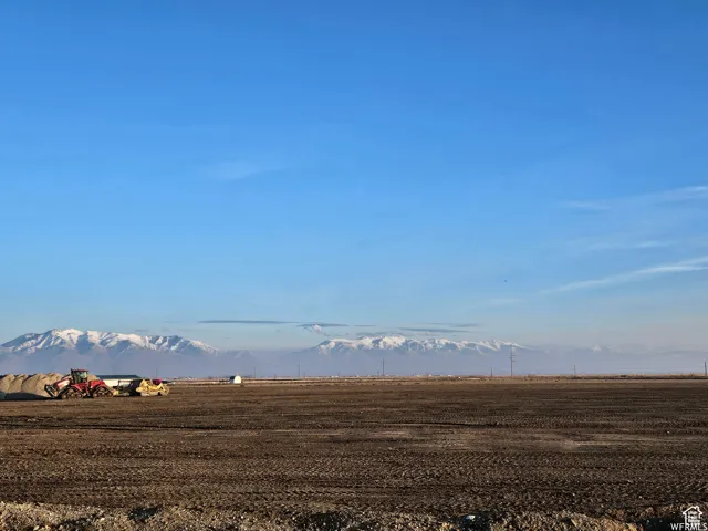 View of mountain backdrop with rural landscape