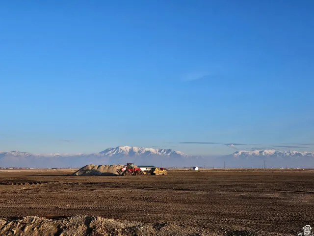 View of mountain backdrop with rural landscape