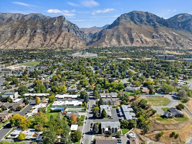View of property location with a mountainous background and nearby suburban area
