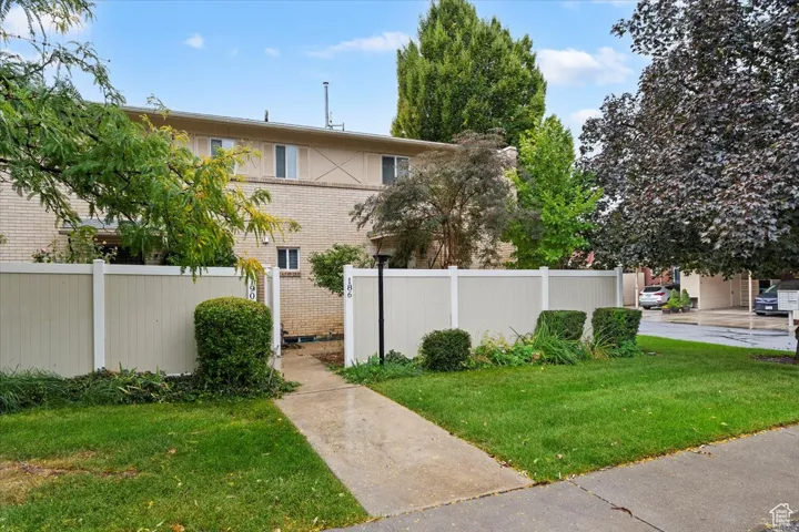 View of property exterior with brick siding