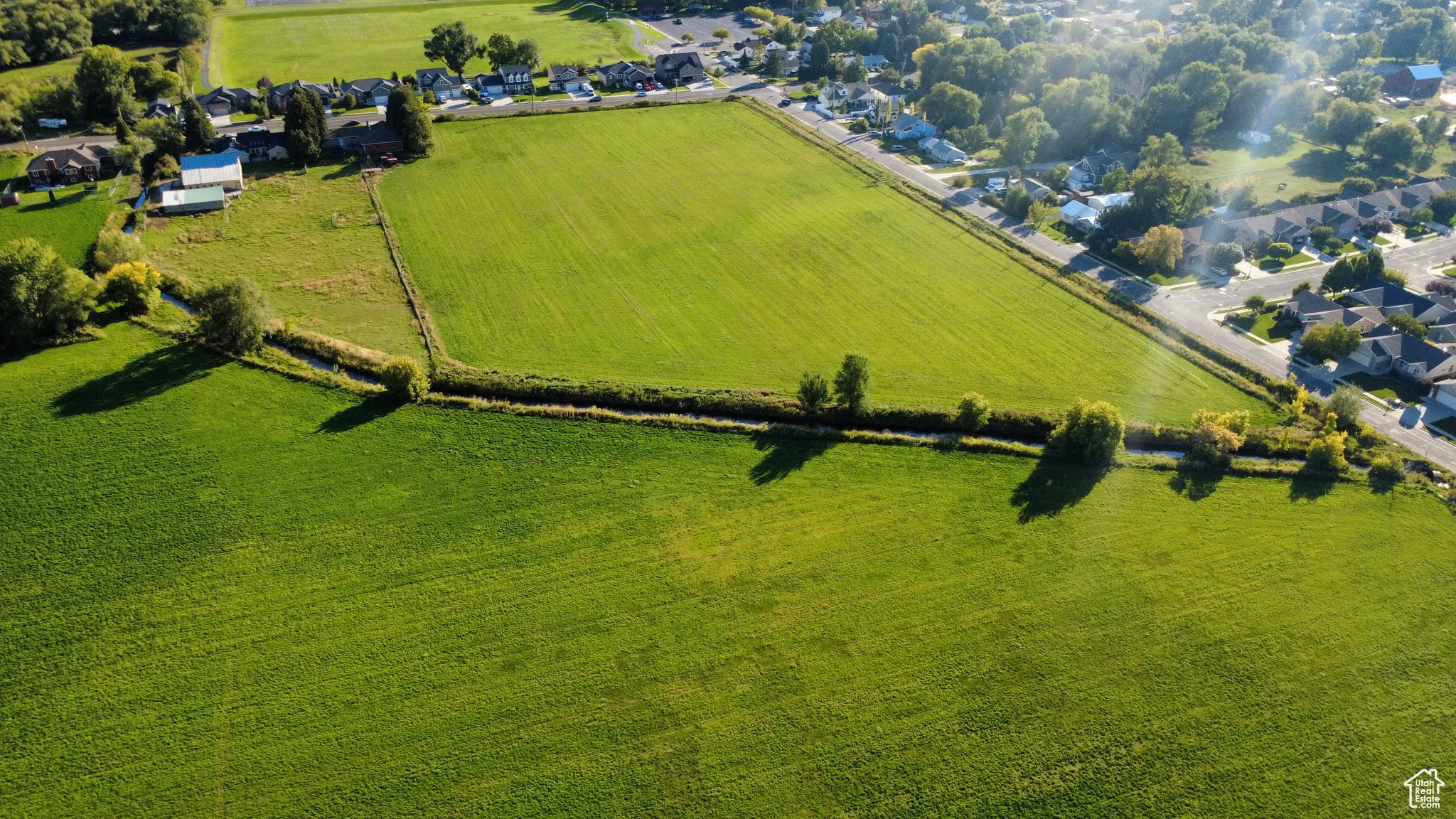 Overview of rural landscape featuring nearby suburban area