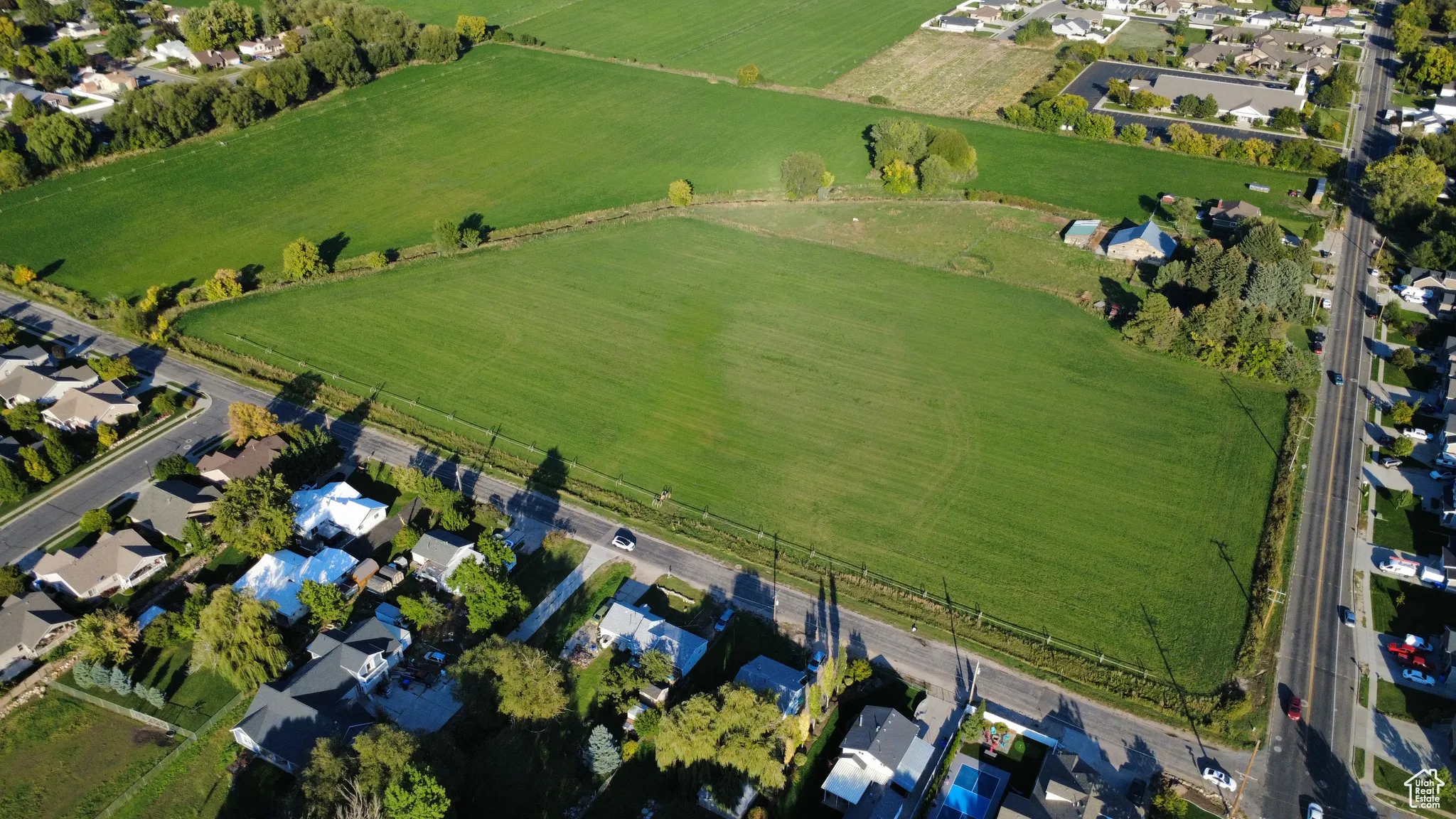 Aerial view of property's location featuring nearby suburban area