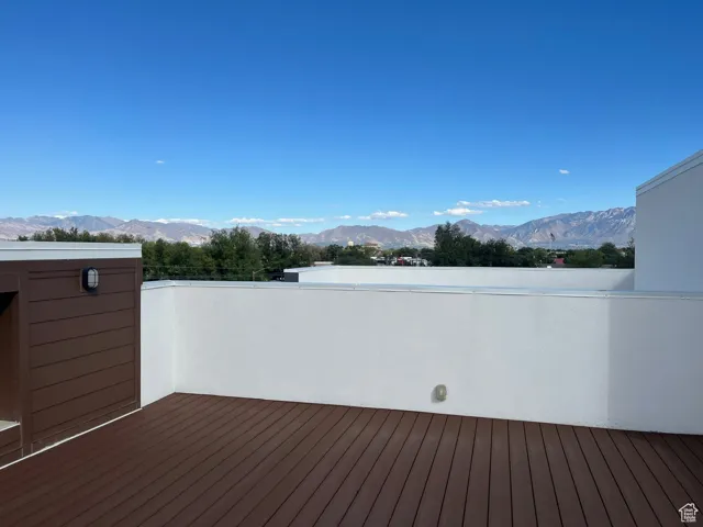 Wooden deck featuring a mountain view