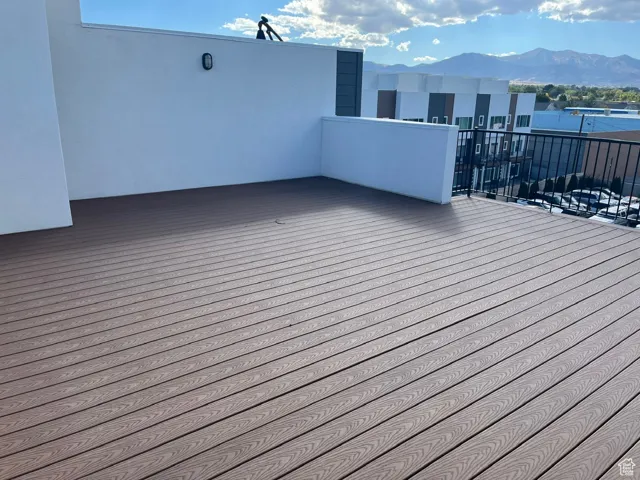 Wooden deck featuring a mountain view