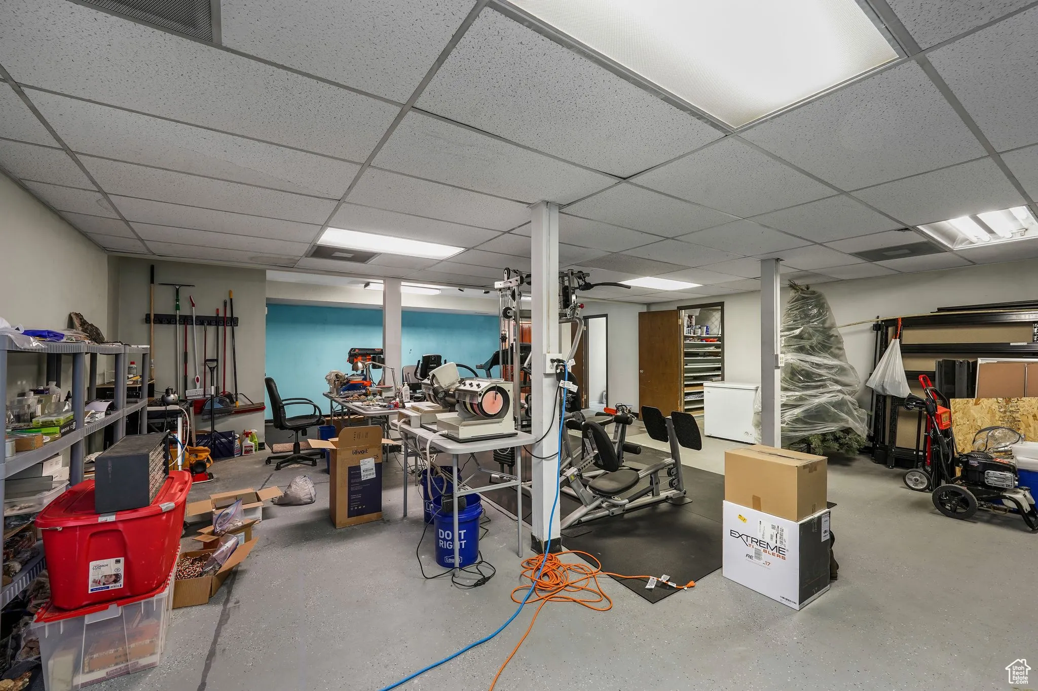 Finished basement with a paneled ceiling
