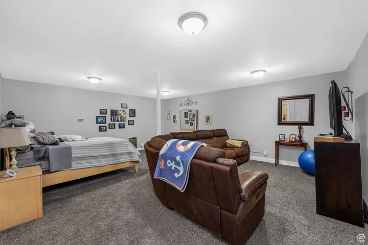 Carpeted bedroom with baseboards