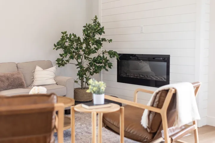 Living area featuring a glass covered fireplace
