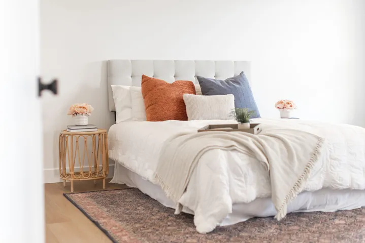 Bedroom with wood finished floors and baseboards