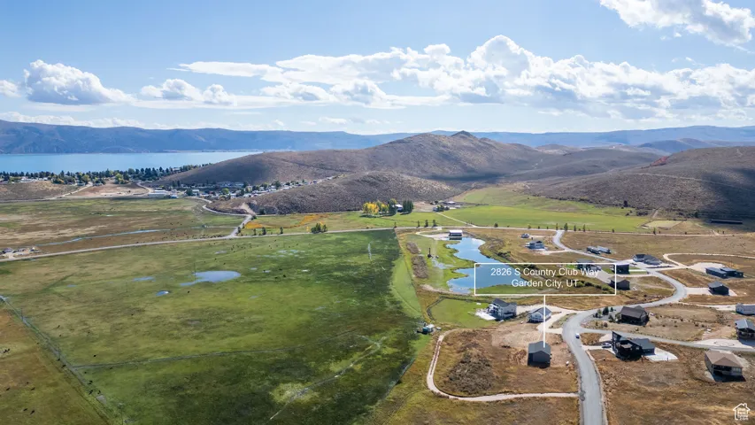 View of property location with a water and mountain view and rural landscape