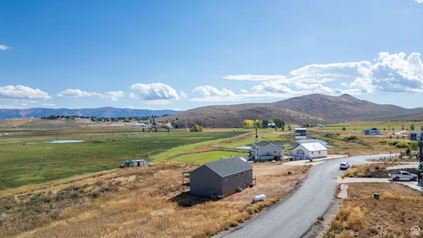 View of mountain background featuring rural landscape and agricultural land
