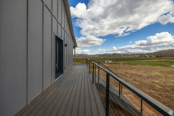 Deck featuring a mountain view and a rural view