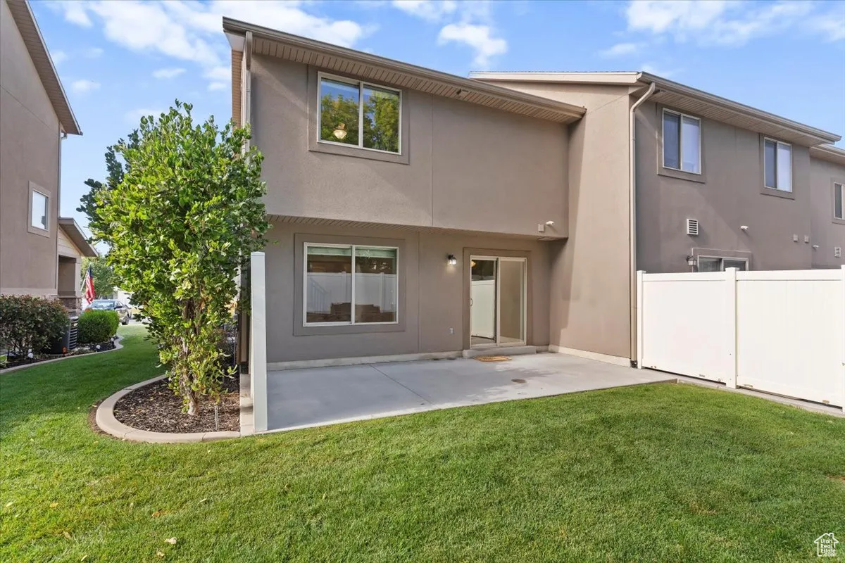 Back of house featuring stucco siding and a patio area