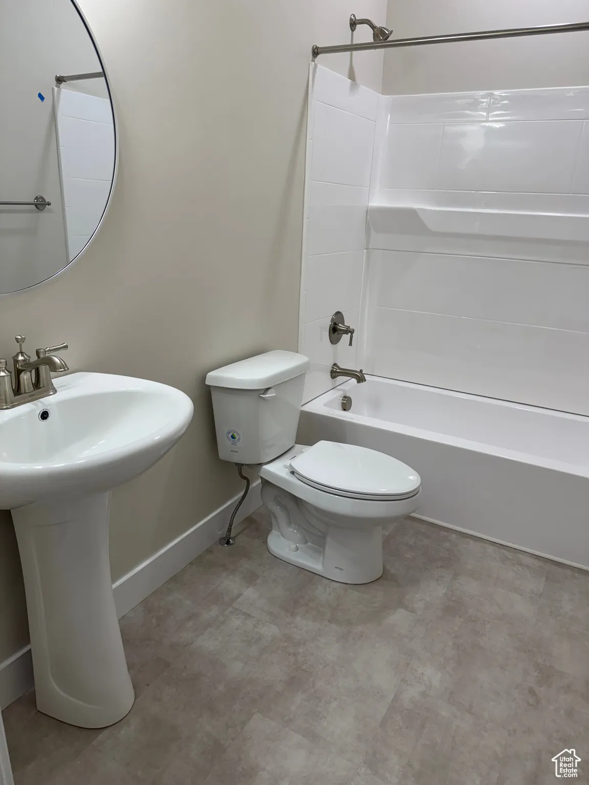 Bathroom featuring shower / tub combination and toilet