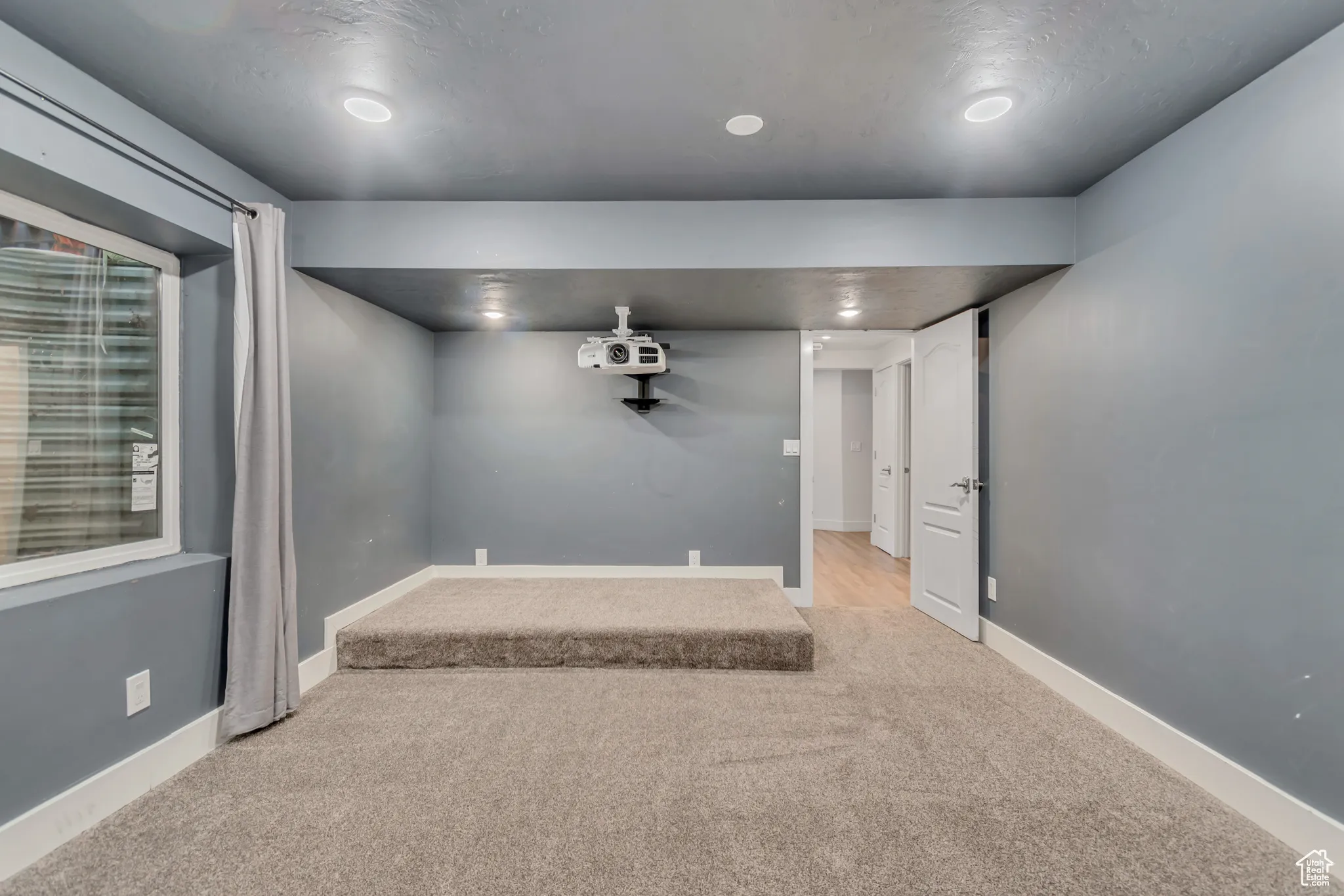 Unfurnished room featuring carpet floors and recessed lighting