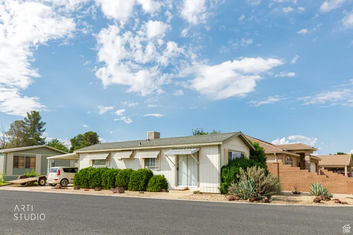 Ranch-style house featuring a carport