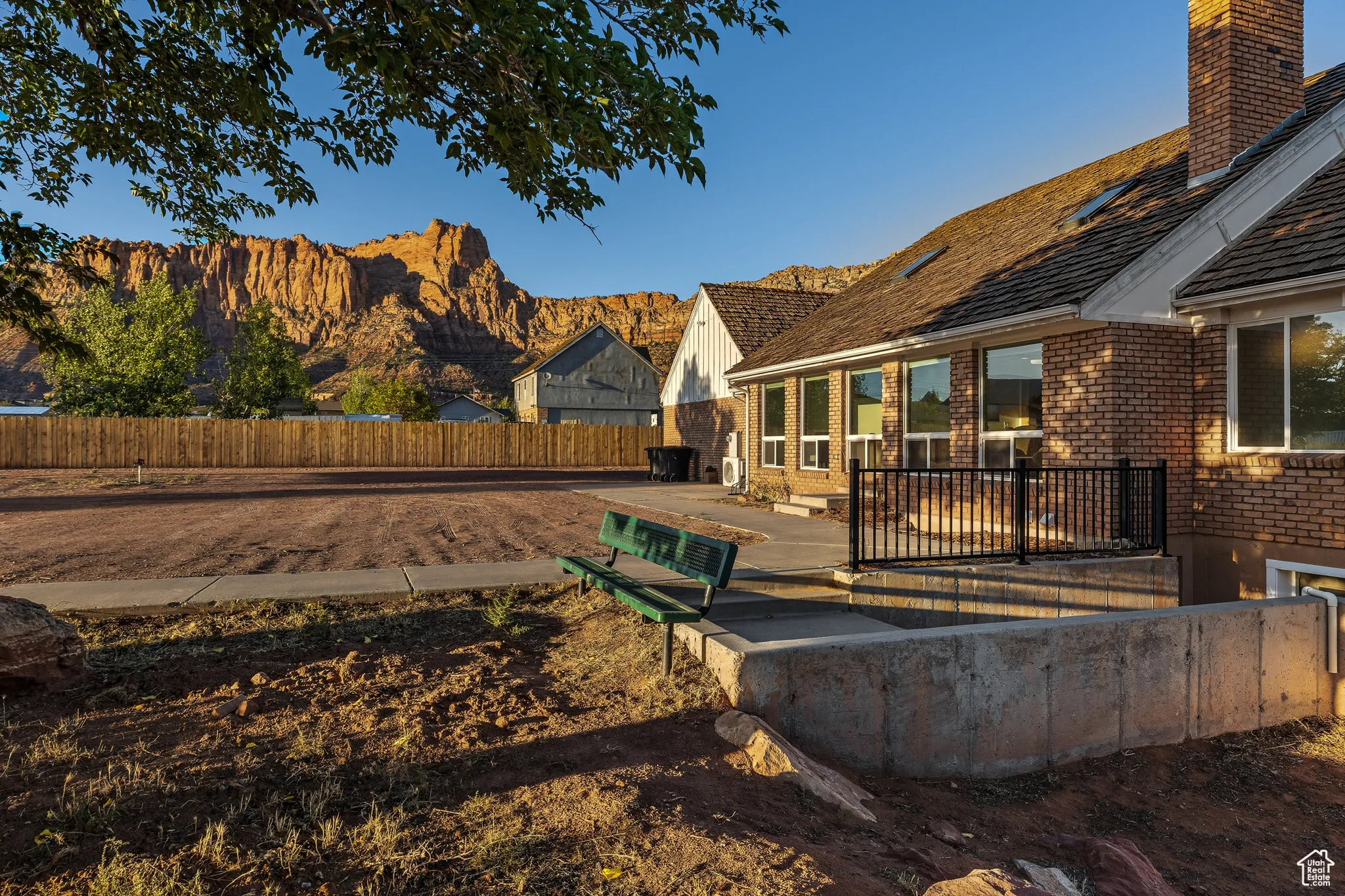 Fenced yard with a patio and a mountain view