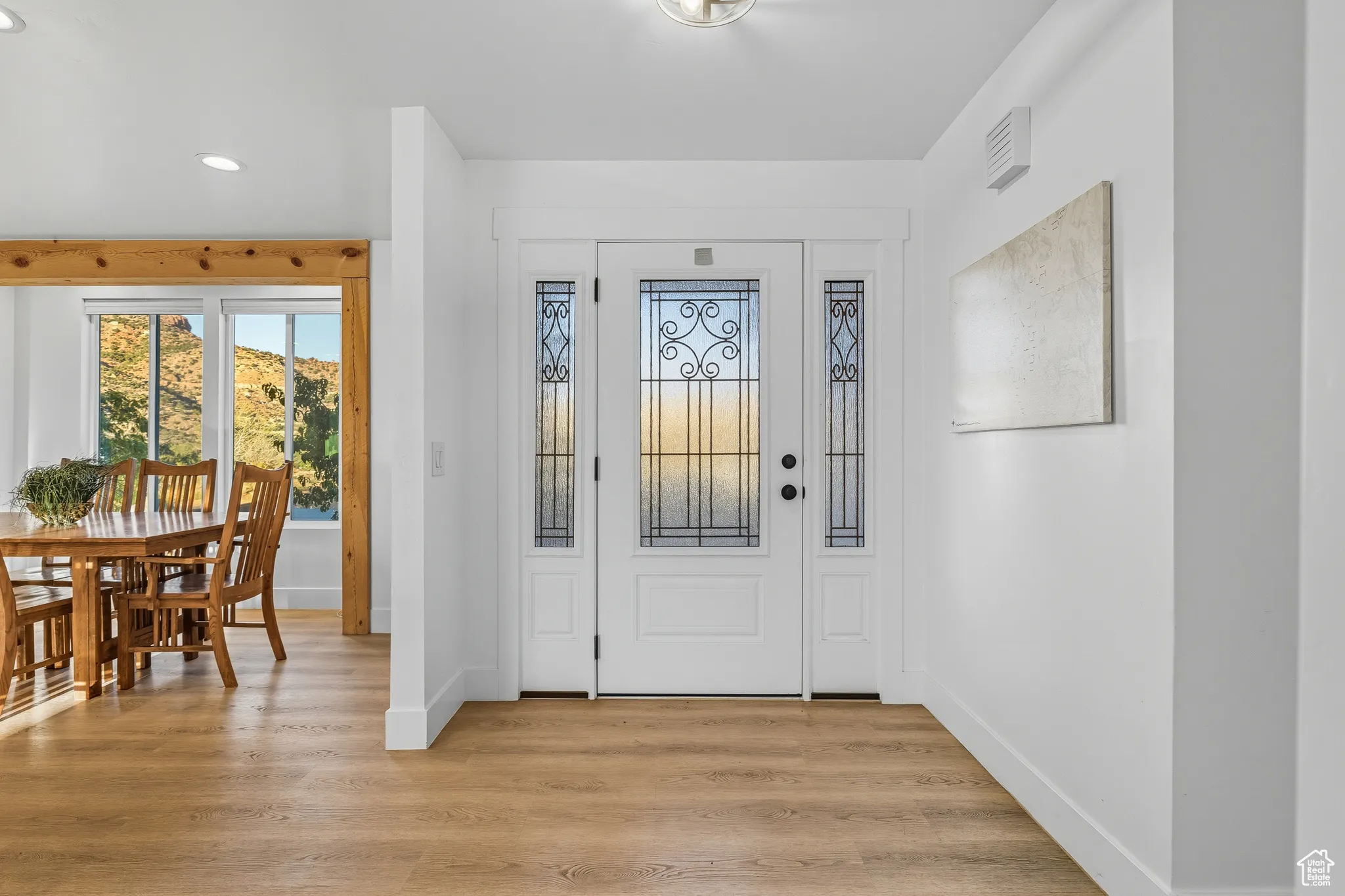 Entrance foyer with recessed lighting and light wood finished floors