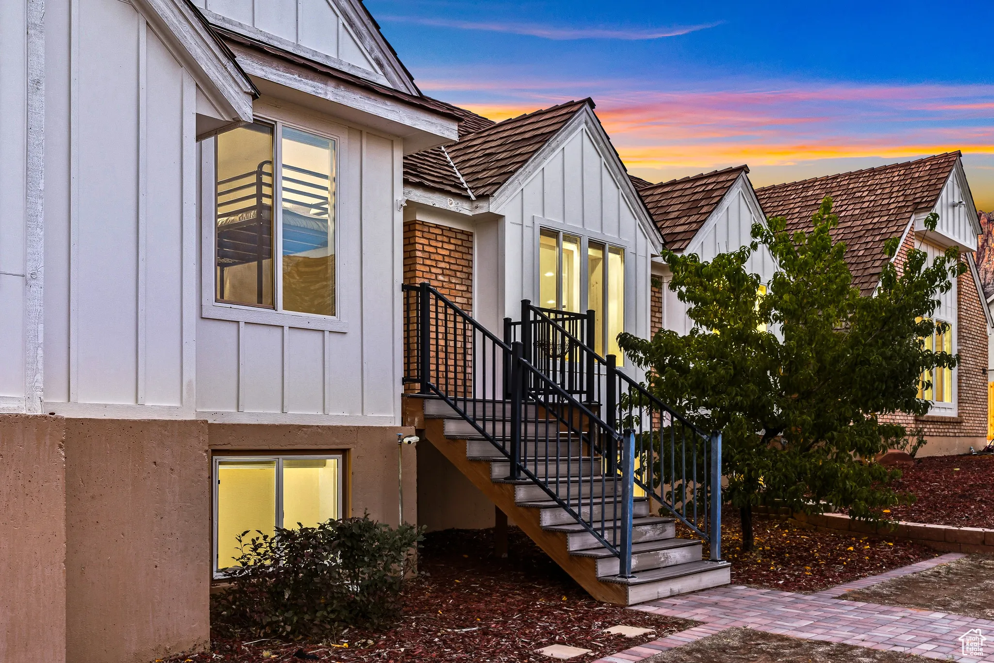 Property entrance featuring board and batten siding