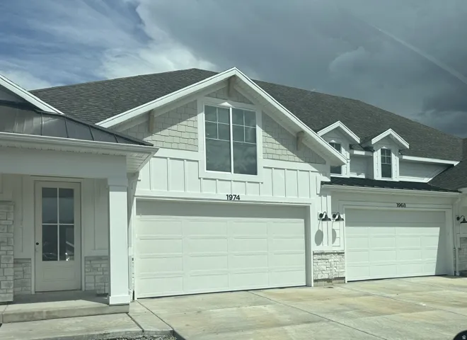 Garage featuring driveway