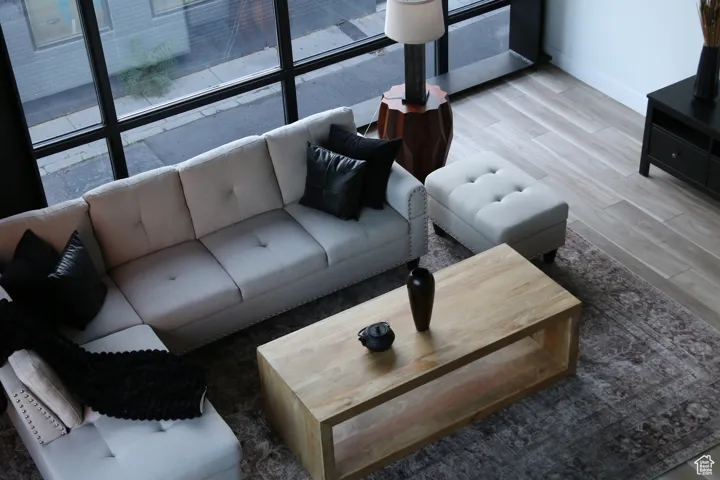 Living area featuring light wood-style flooring and baseboards
