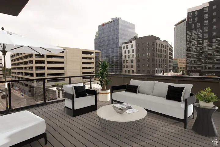 Wooden terrace featuring a city view and outdoor lounge area