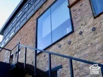 View of side of property with brick siding