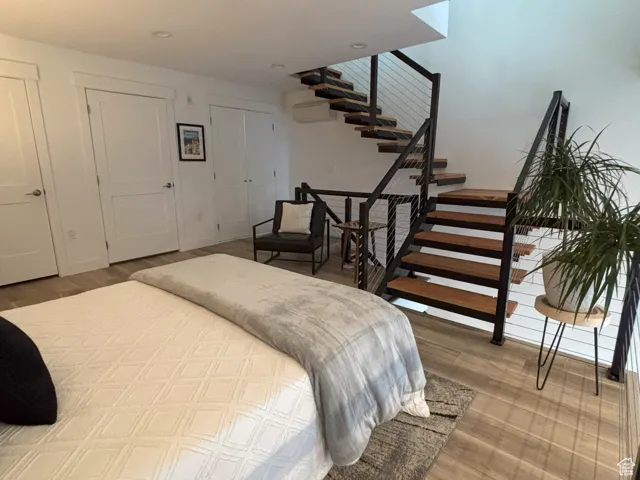 Bedroom featuring closet, and closet with washer and dryer hookups.