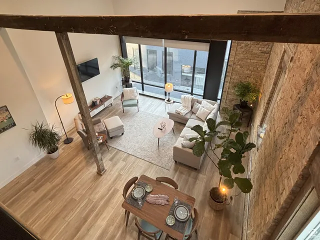 Living room with recessed lighting and wood finished floors