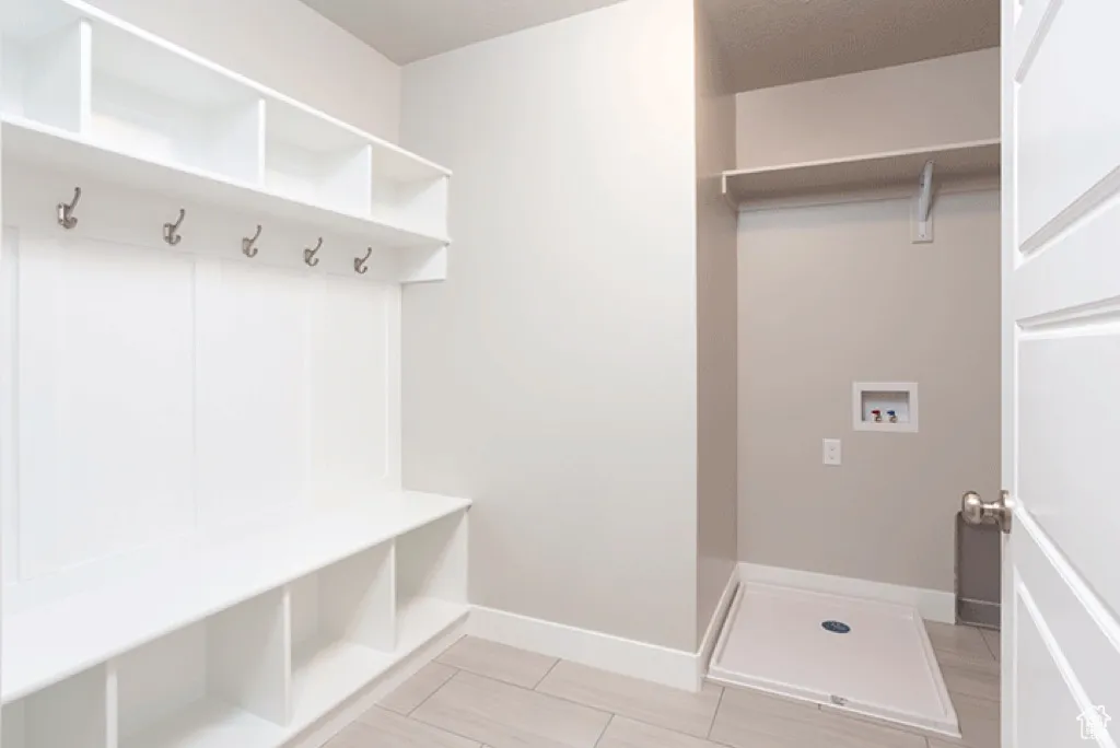 Mudroom featuring baseboards