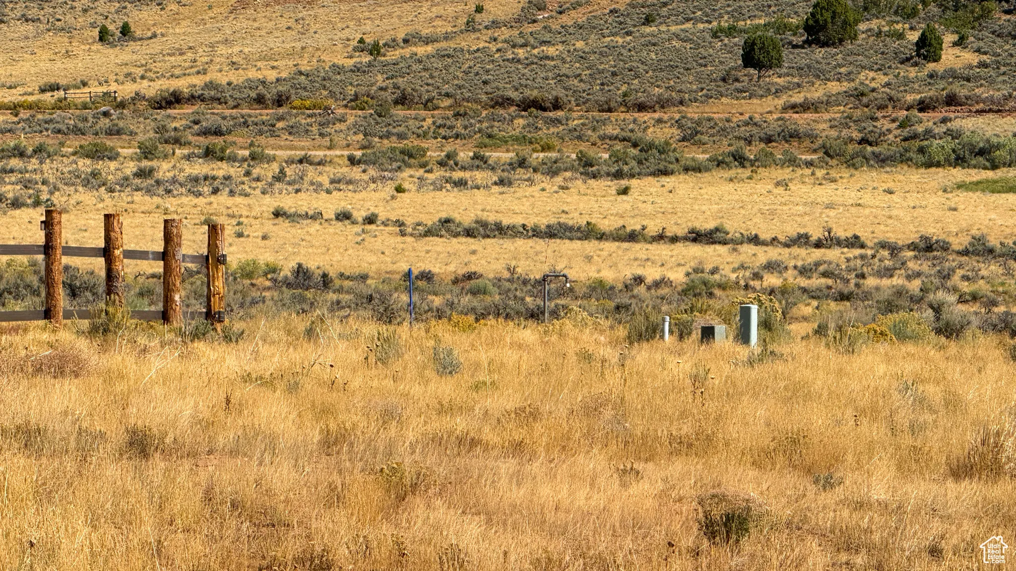 View of mountain backdrop with rural landscape