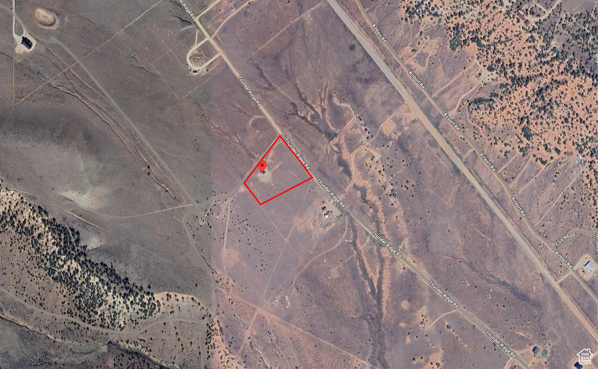 Aerial map of property and surrounding area featuring property parcel outlined