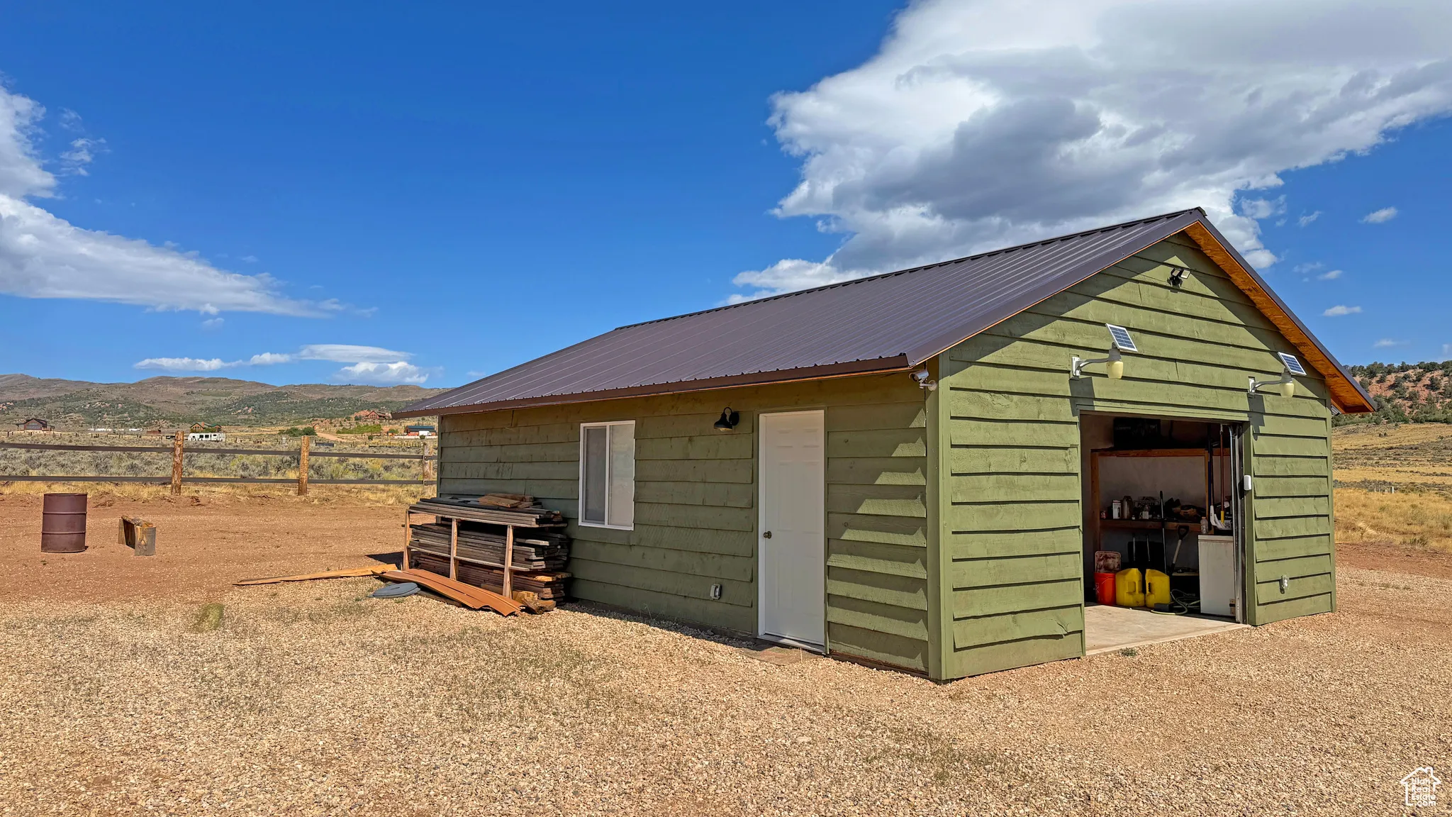 View of outbuilding featuring a mountain view