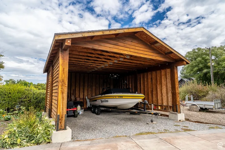 Garage featuring a carport