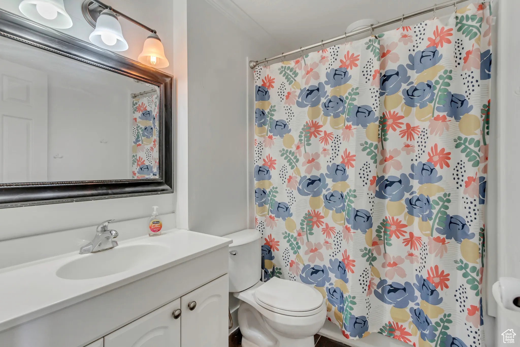 Full bath featuring vanity and a shower with curtain